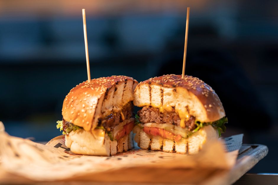 Gourmet burger with fresh ingredients and professional presentation